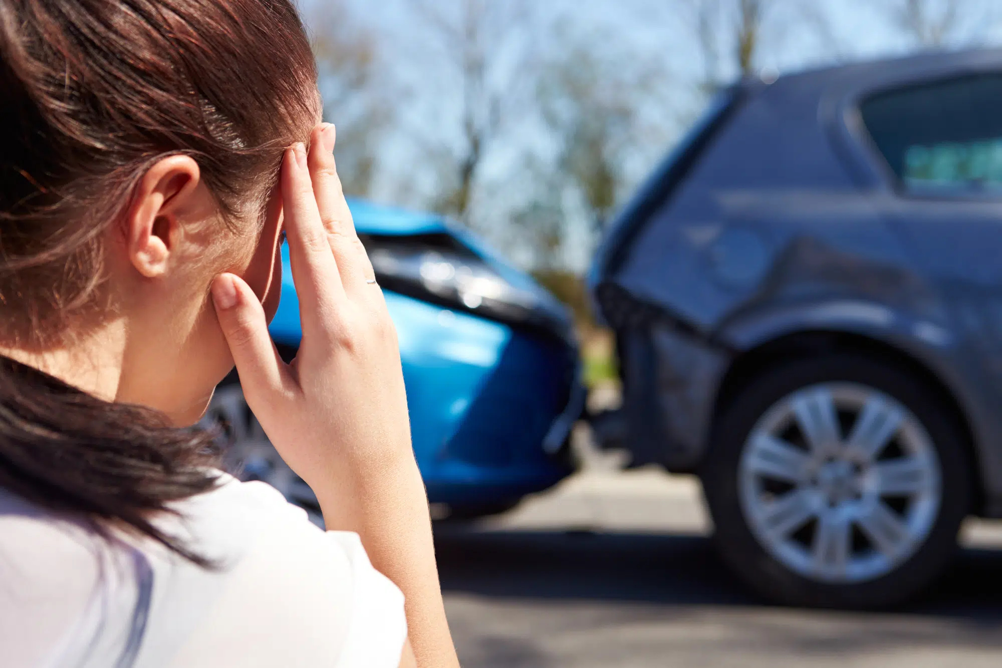 person cringing looking at car wreck