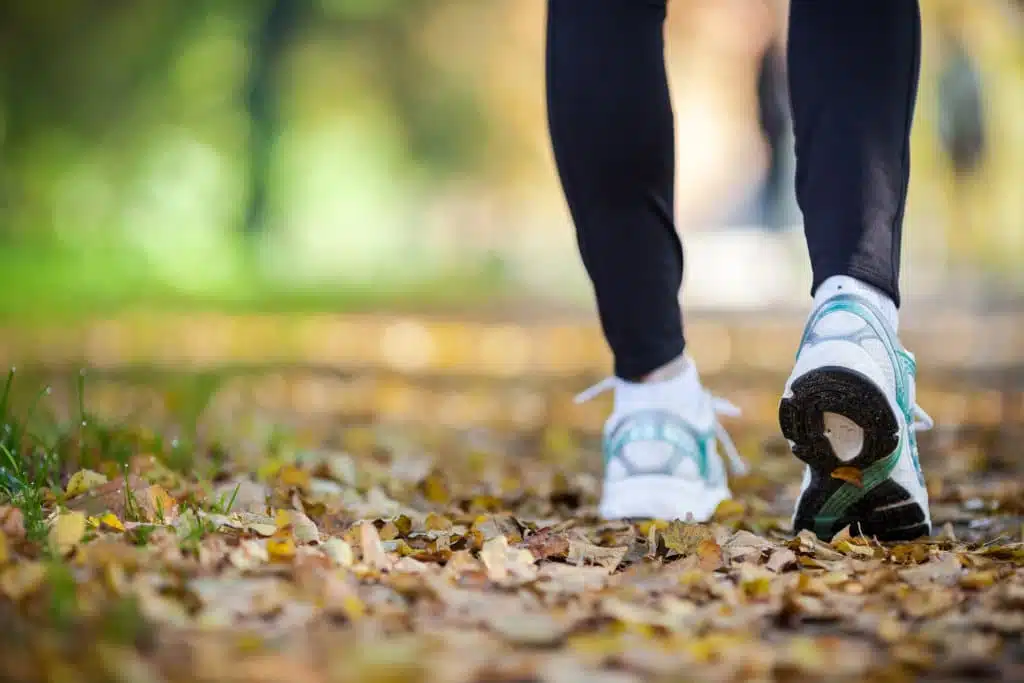 person walking on trail