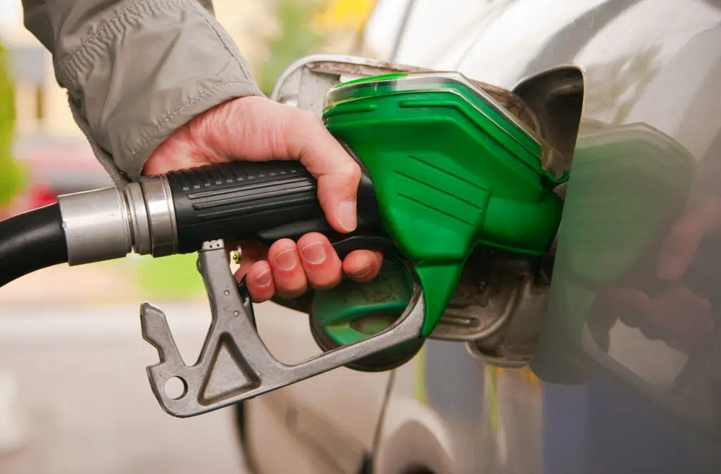 green gas pump in car