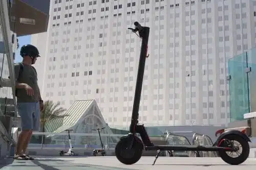 Gotrax GXL V2 by man standing