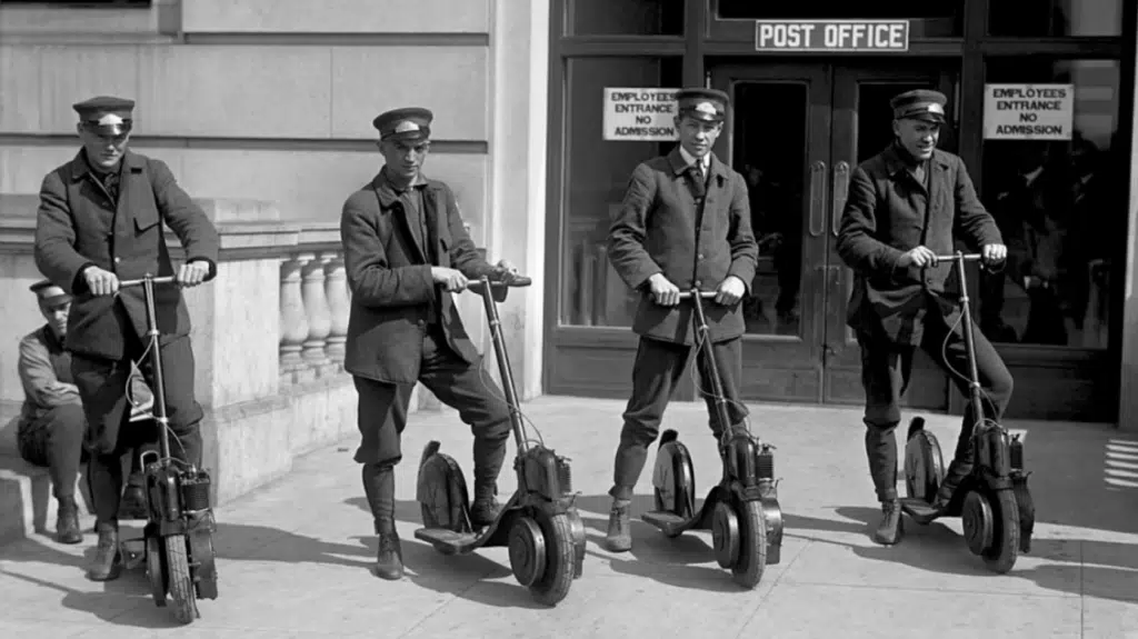 4 police officers on electric scooters black and white