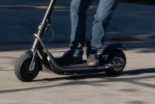 man riding boosted rev electric scooter