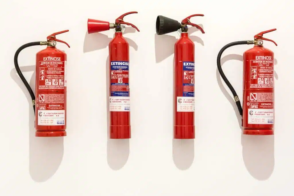 4 fire extinguishers together 