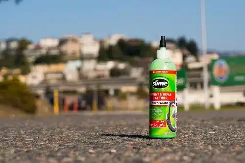 Bottle of green tire slime