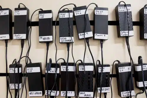 the rider guide chargers on a wall together