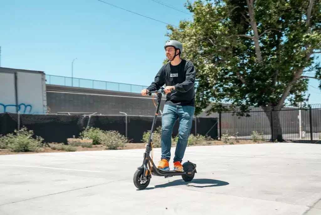 Segway-Ninebot-F2-Pro-electric-scooter-mitchell-riding (2)