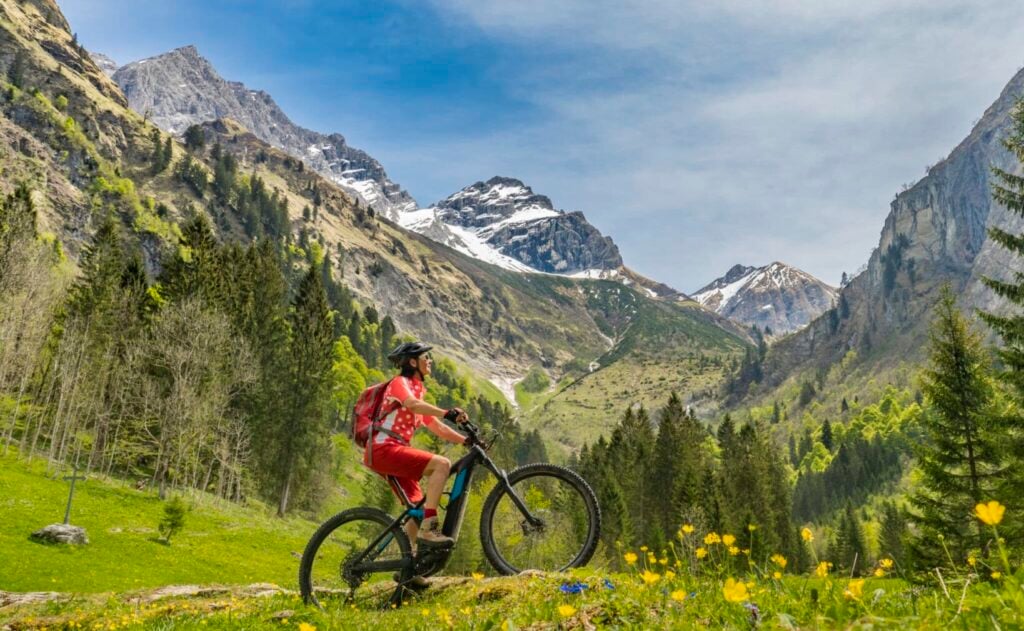 woman riding an electric bike in the mountains