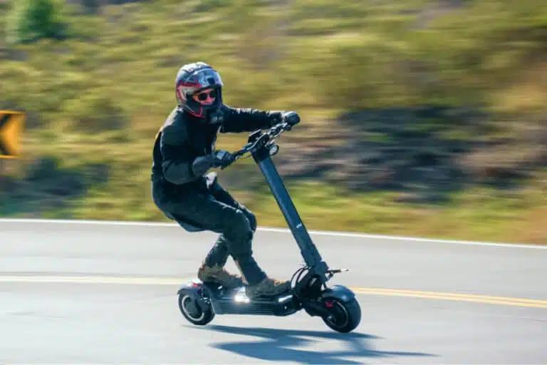 The EMOVE Roadster Review 7 man riding emove roadster electric scooter fast on a highway