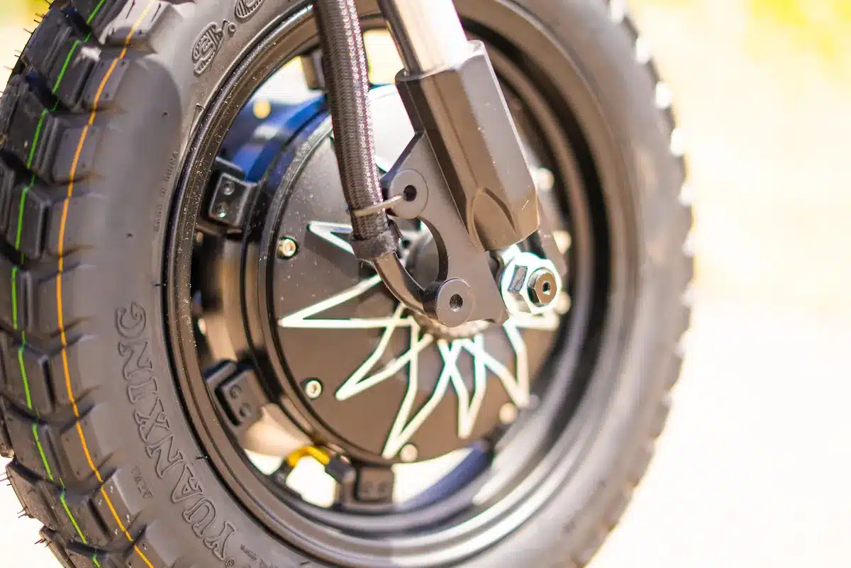 EMOVE RoadRunner Pro V2 Review: Surron Power in a Tiny, Stealthy Package 3 EMOVE RoadRunner Pro V2 front hub motor and 14 inch tubeless tire