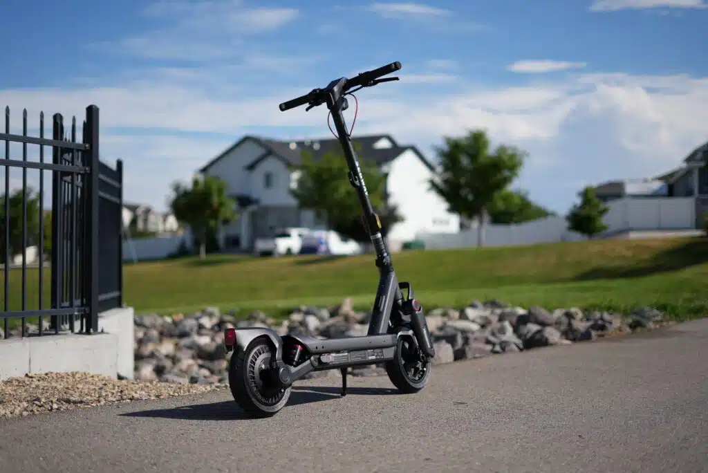 Segway MAX G3 Plus First Impressions: They Really Surprised Us 5 Segway MAX G3 Plus seen from behind on a suburban street, showing the rear fender and taillight