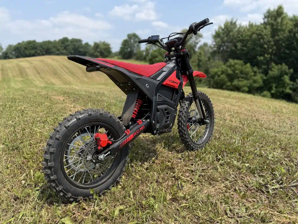 Yozma IN10 Pro Review: Is This $2,000 E-Dirt Bike a Real Sur Ron Killer? 7 Yozma IN10 Pro parked on a trail, rear view