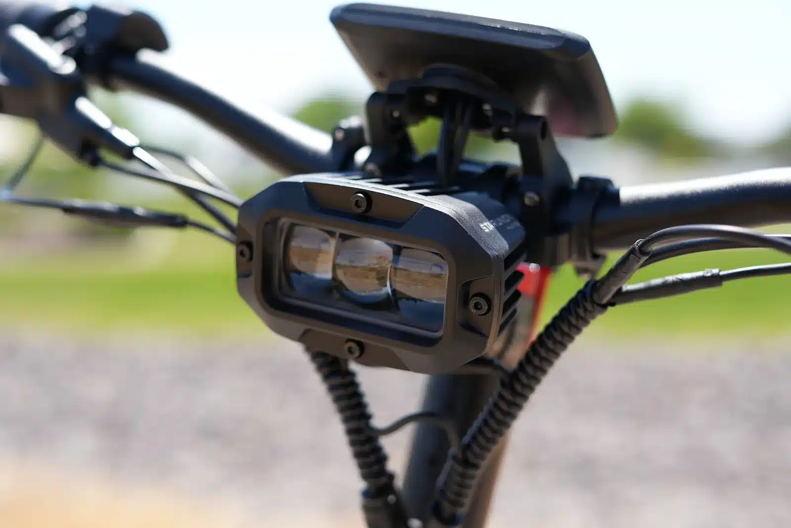 YUME Raptor 2 front headlights (4,500 lux) Close-up of the YUME Raptor 2 front headlight cluster, whose top projector measured 4,500 lux on our light meter