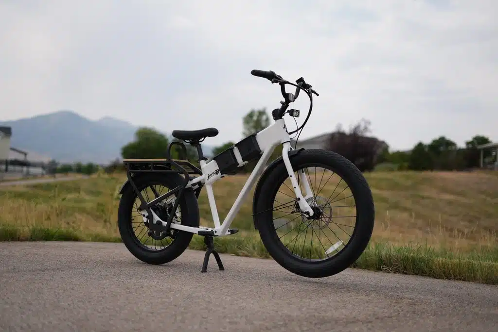 The Best Cargo eBikes for Hauling Kids, Groceries and Everything Else 4 JackRabbit MG Cargo on its center stand during RiderGuide testing