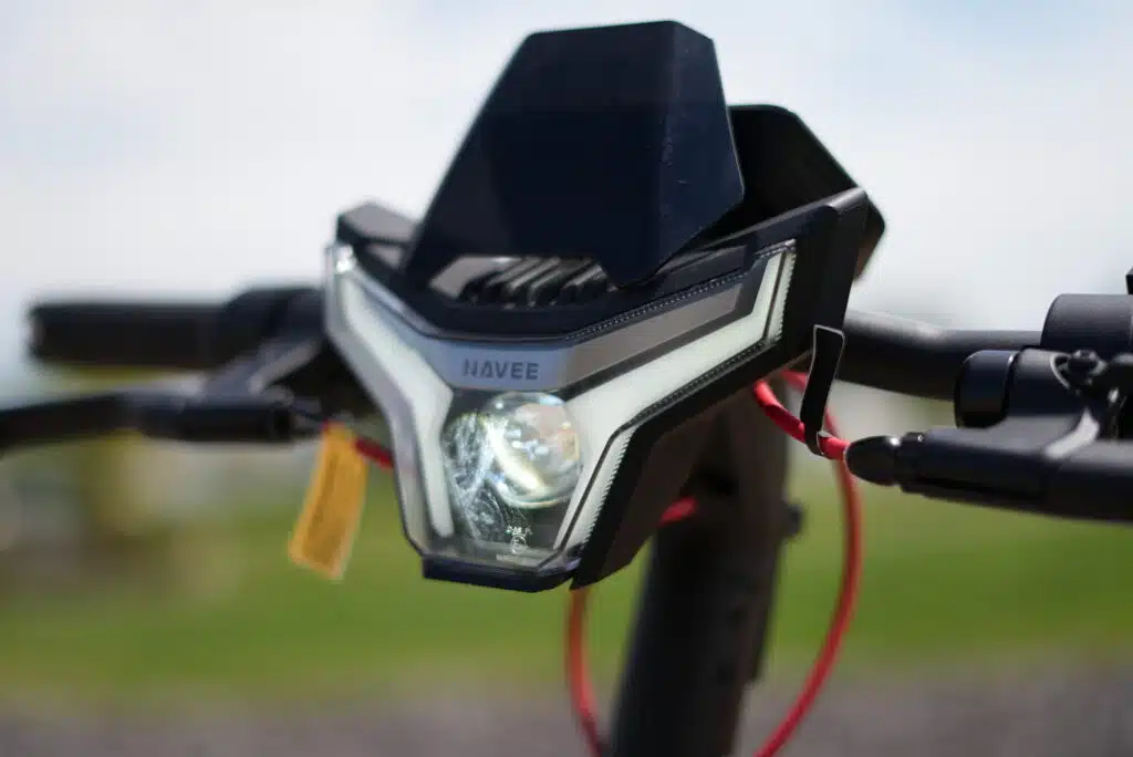 NAVEE XT5 Pro Review: A Fast, Stable 31 MPH Scooter With Serious Tech 6 NAVEE XT5 Pro headlight lit up during testing