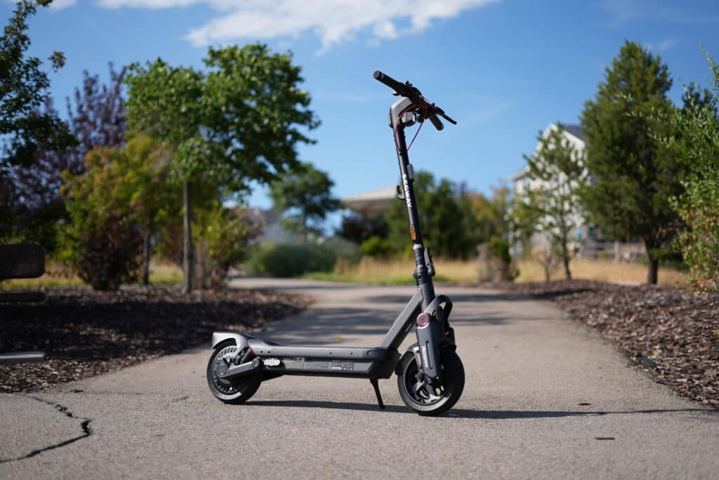 Segway MAX G3 Plus electric scooter parked on pavement, front three-quarter view
