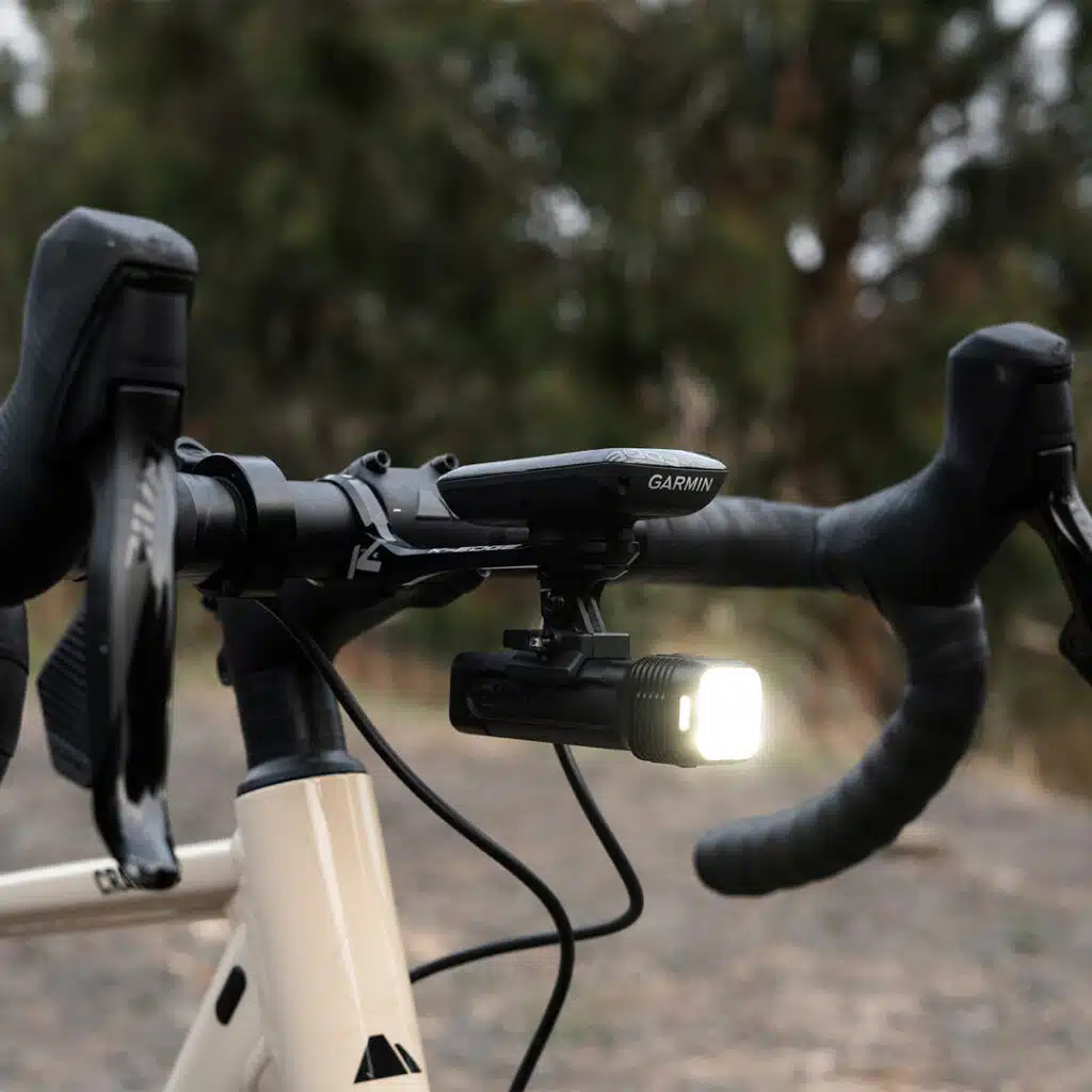 The 5 Best eBike Lights on Amazon Now That It Gets Dark at 6 2 Knog Blinder 1300 headlight mounted under a bike computer on a handlebar