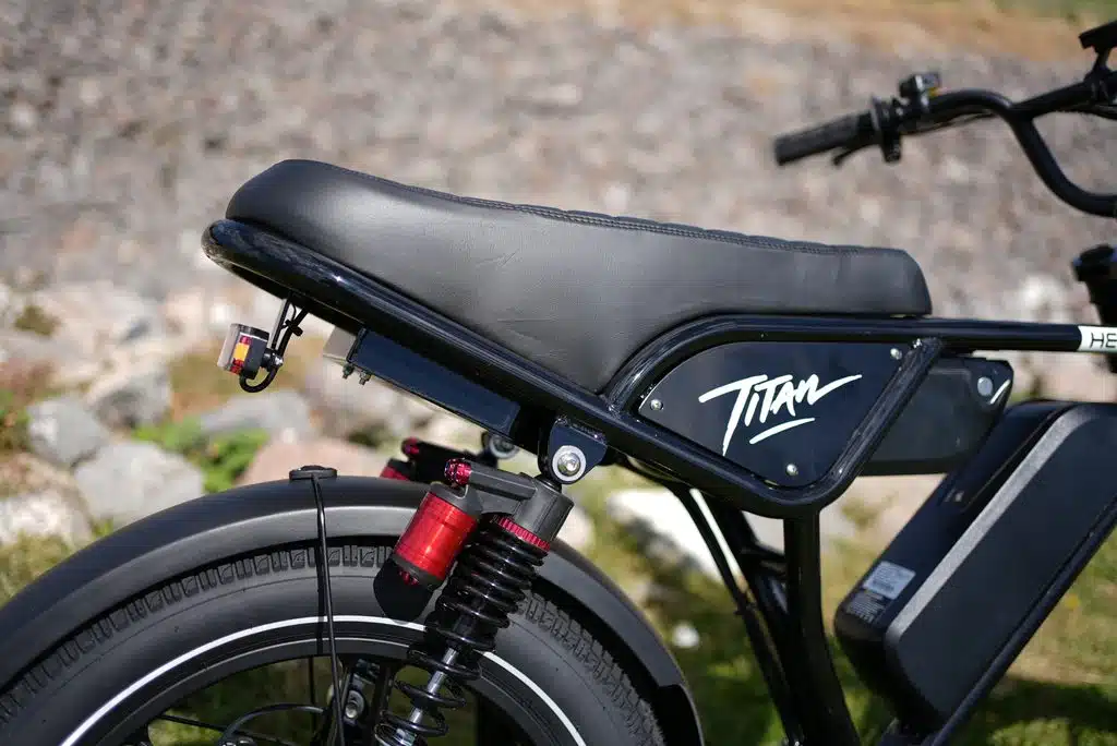 Heybike Titan Review: Street Legal, Built for Distance, and a Real Saturn Rival 2 Heybike Titan two-up saddle, rear spring shock and Titan side badge